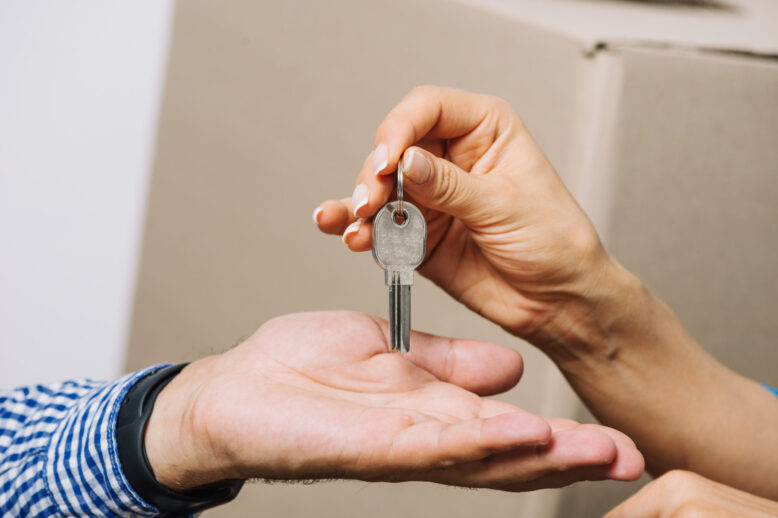 crop-people-exchanging-with-keys